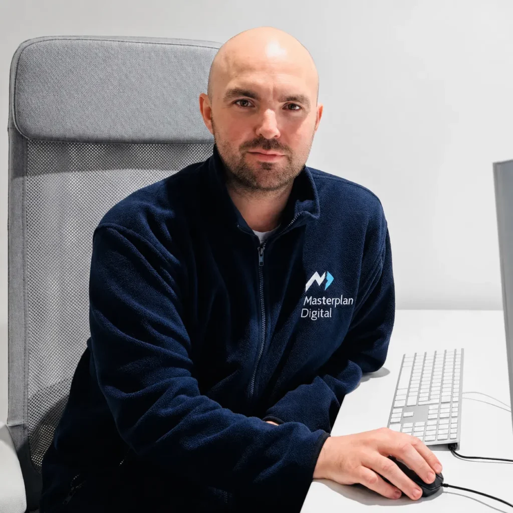 Jon Moody from Masterplan Digital working on a laptop at his desk